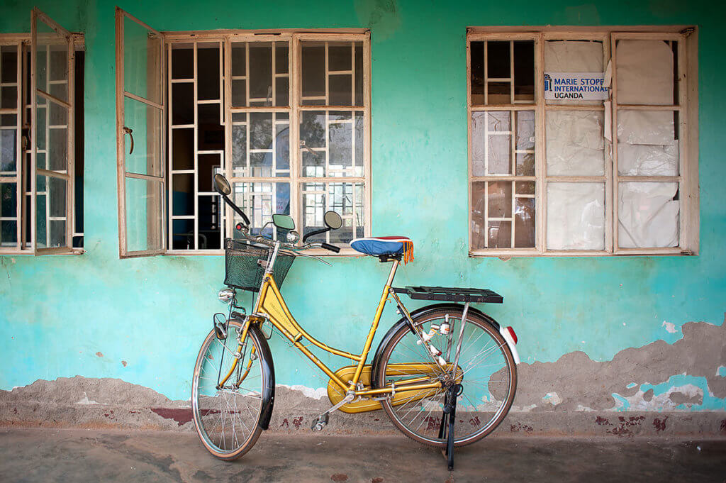 A blue painted wall outside a health facility in Uganda.