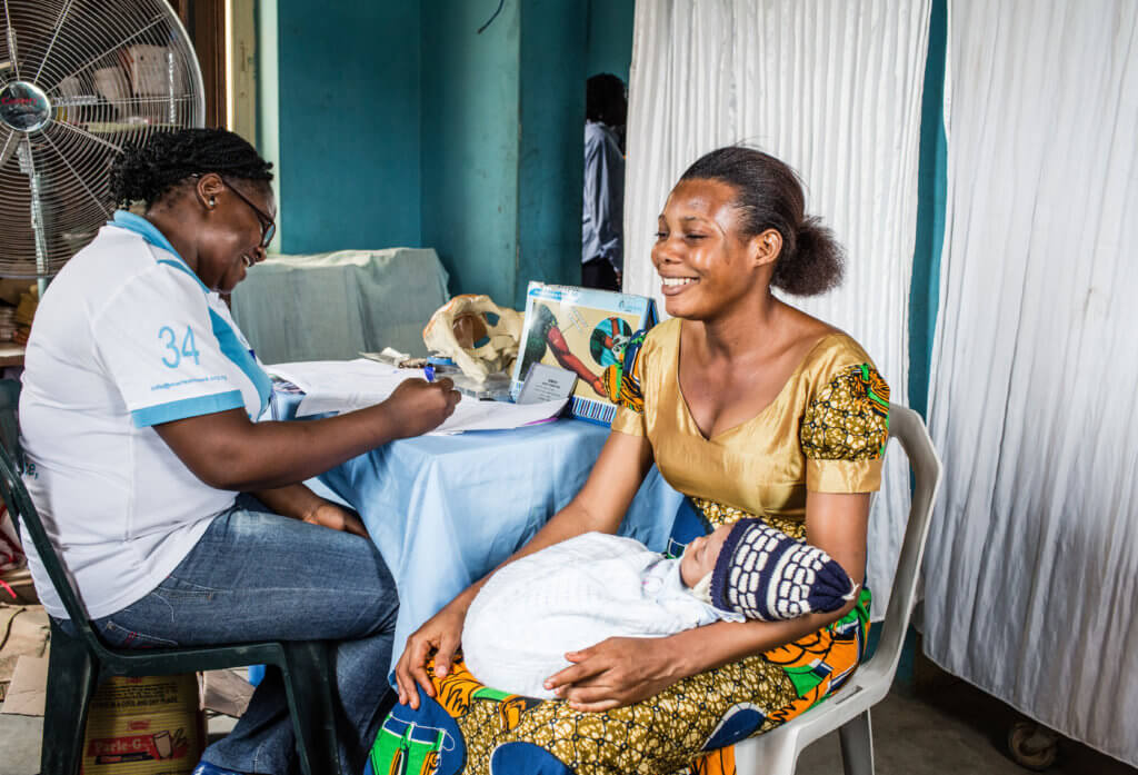 Mrs. Igboke, Clinical Service Provider, counsels Mrs. Monica about family planning at Iju Primary Health Center, Ogun State
