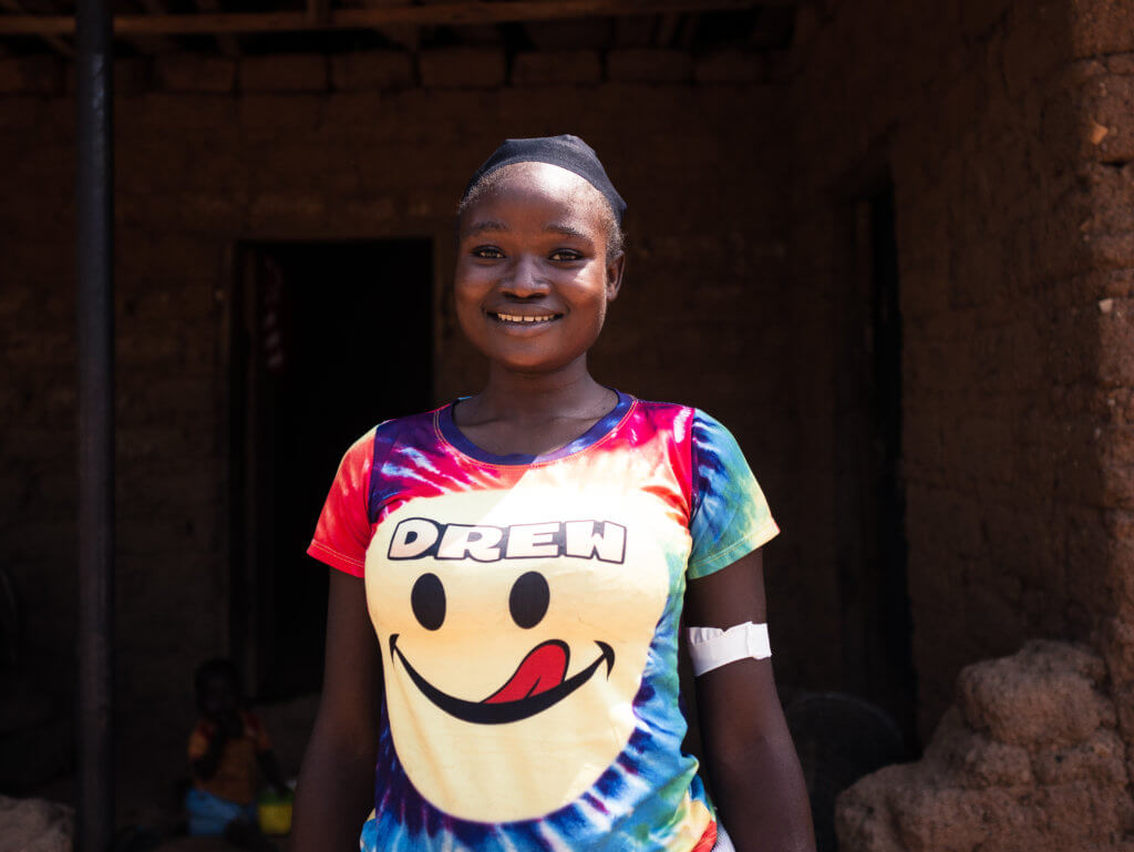 A teen client smiles after receiving a contraceptive implant. Adolescents are at high risk of pregnancy complications.