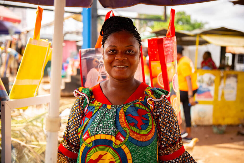 Beatrice, and MSI client at her mobile money stall in Kumasi, Ghana