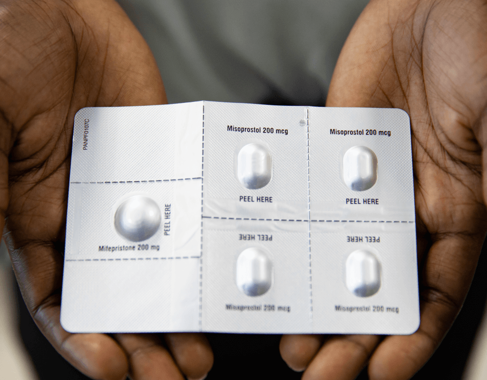 A pack of medication abortion pills, with one mifepristone tablet and four misoprostol tablets in a blister pack.